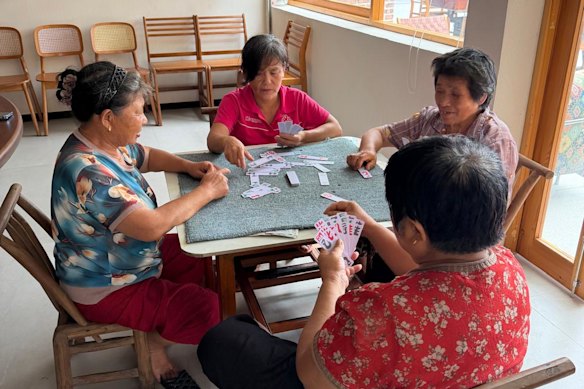Playing cards with neighbours is a routine pastime in rural China.