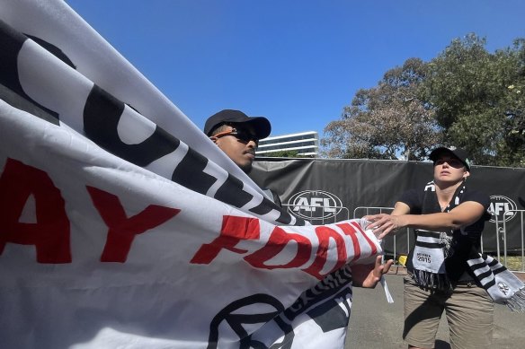 Protesters pulled their banner across the bridge in front of the vehicles.