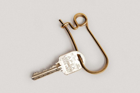 Brass keyring with secure screw closure, made in Japan.