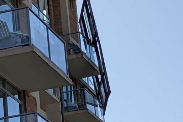 A window was left dangling from a Paddington apartment on Friday afternoon.