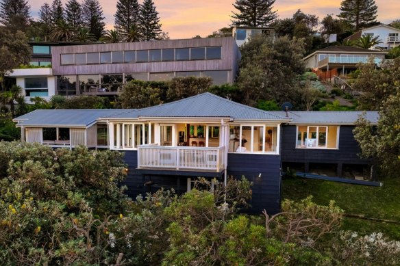 Krisy Carr’s contemporary Newport home is set directly behind her weatherboard cottage that backs onto Bungan Beach.