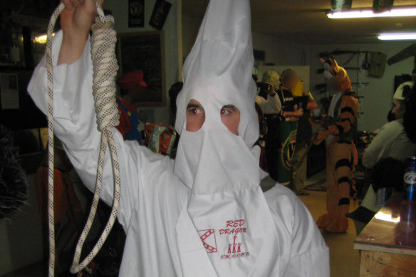 A special forces soldier dressed in a Ku Klux Klan outfit at a party at soldiers’ bar the Fat Ladies Arms in Afghanistan.