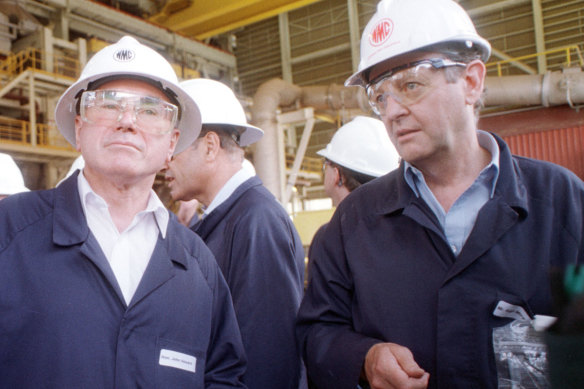 Prime Minister John Howard (left) is shown around the expanded Olympic Dam mine in South Australia by Western Mining's Hugh Morgan in 1999. Morgan had begun his campaigns to influence politicians in the 1970s.