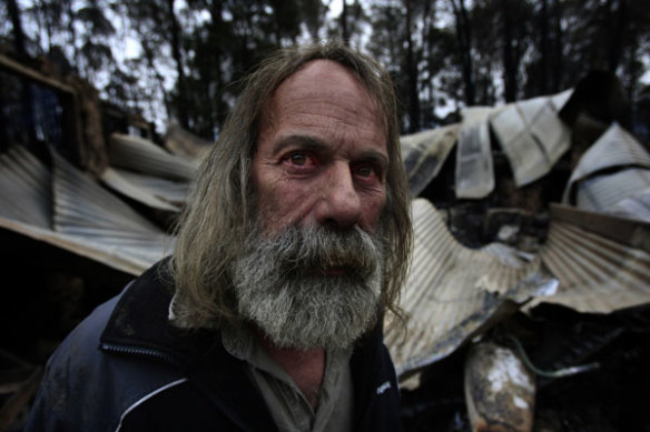 Rob Hallett in front of his stone shed in Narbethong which housed his antique motorcycle collection and gun collection.