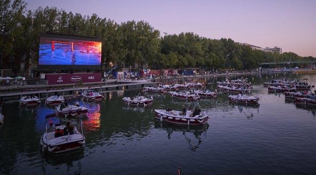 The opening night of Paris' free floating cinema in July. It had 38 electric boats on the Quai de Seine in compliance with social distancing rules, with 150 deckchairs on the banks of the canal. 