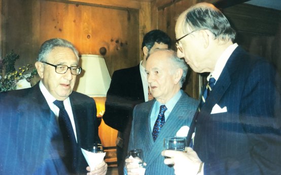 Henry Kissinger, Owen Harries and Harvard political scientist Samuel Huntington at the National Interest editorial board drinks in 1998.