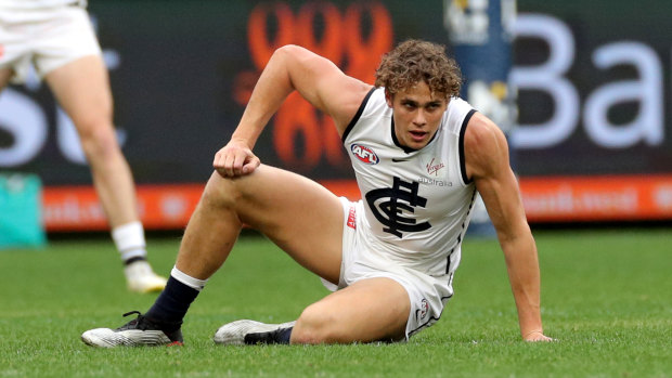 Stricken: Charlie Curnow of the Blues reacts after being injured at Optus Stadium.