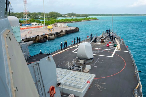 US Navy sailors aboard the USS Paul Hamilton during a routine port visit at Diego Garcia.  
