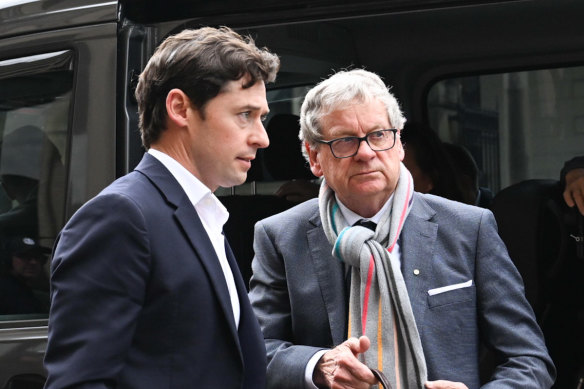 Journalists Nick McKenzie (left) and Chris Masters arrive at the court on Thursday.