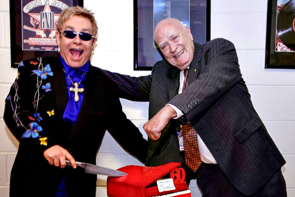 Elton John and Michael Chugg celebrating their 60th birthdays in 2007 at Acer Arena (now Qudos Bank Arena) at Sydney Olympic Park.