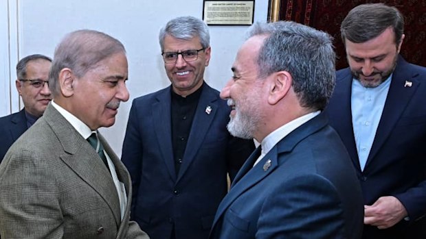 In this photo released by the Pakistan Prime Minister Office, Prime Minister Shehbaz Sharif, left, greets Iran’s Foreign Minister Abbas Araghchi before their meeting in Islamabad at the weekend.