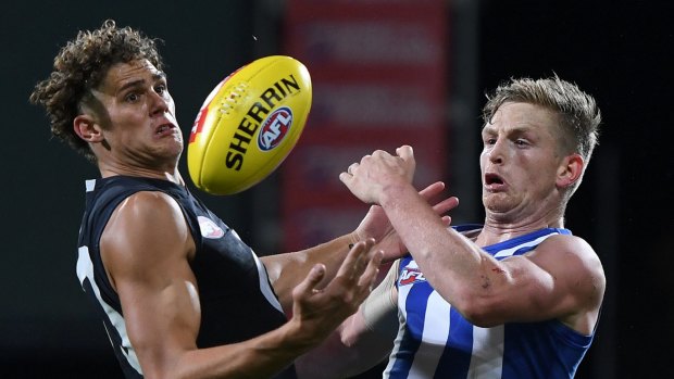 Charlie Curnow and Jack Ziebell fight for the ball.