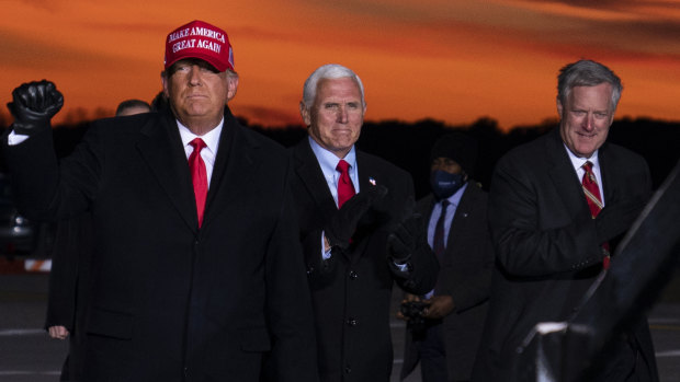 Mark Meadows, pictured on the right, is seen with Trump and Mike Pence at a campaign rally on November 2.