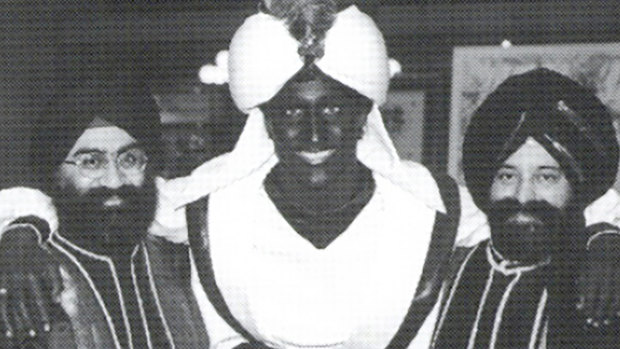 This April 2001 photo, which appeared in a newsletter from the West Point Grey Academy, shows a costumed Justin Trudeau, his face and hands darkened by makeup, attending an "Arabian Nights" gala. 
