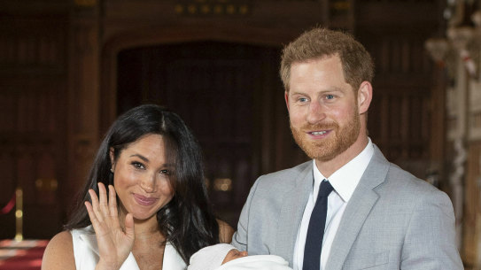 Britain's Prince Harry and Meghan, Duchess of Sussex, during a photocall with their newborn son, in St George's Hall at Windsor Castle, Windsor, south England, Wednesday May 8, 2019. Baby Sussex was born Monday at 5:26 a.m. (0426 GMT; 12:26 a.m. EDT) at an as-yet-undisclosed location. An overjoyed Harry said he and Meghan are "thinking" about names. (Dominic Lipinski/Pool via AP)