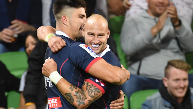 Jack Maddocks and Billy Meakes celebrate after Maddocks scored for the Rebels against the Brumbies at AAMI Park on Friday night.