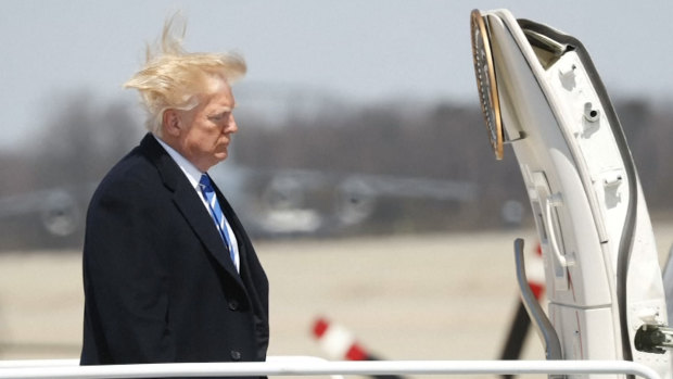 Bad hair day: US President Donald Trump boards Air Force One as seen in a screen grab taken from a video. 
