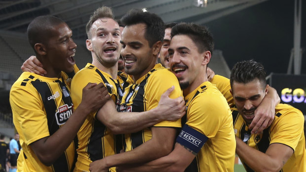 Big win: AEK Athens' Rodrigo Galo, centre, is congratulated after scoring.