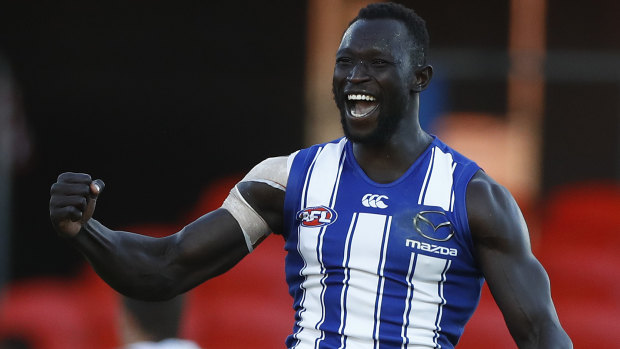 Majak Daw celebrates a goal during his triumphant AFL return.