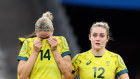 Gutted: The Matildas are holding on by a thread after a 2-1 defeat to the US in Marseilles.