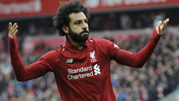 Liverpool's Mohamed Salah celebrates scoring his side's second goal against Chelsea at Anfield on Sunday.