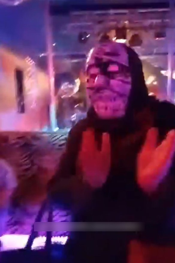 A masked gatecrasher at councillor Stephen Jolly’s election celebration event on Friday November 1, 2024.