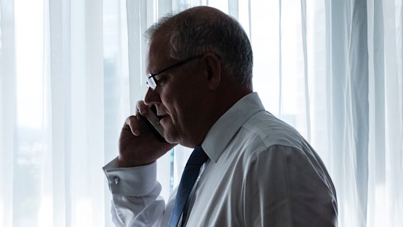 Scott Morrison on the phone to his wife Jenny during a break in his recent Brisbane campaign.