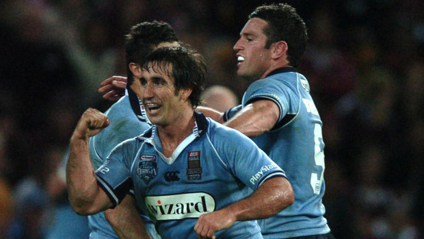 Rare breed: Andrew Johns celebrates victory in the 2005 State of Origin decider in Brisbane.
