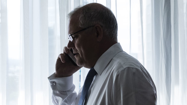 Scott Morrison on the phone to his wife Jenny during a break in his recent Brisbane campaign.