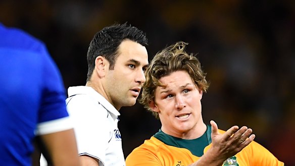 Michael Hooper and referee Ben O’Keeffe.