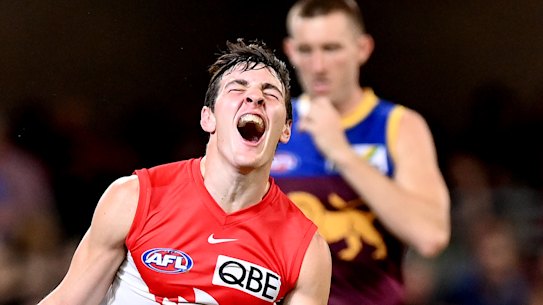 Errol Gulden of the Swans celebrates after kicking a goal.