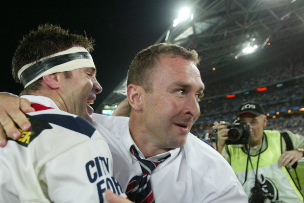 Ricky Stuart celebrates with Brad Fittler after winning a title in his first season as a coach with the Roosters in 2002.