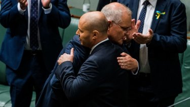 Treasurer Josh Frydenberg is congratulated by Prime Minister Scott Morrison after handing down the 2022 budget in March. Interest rates on global debt have soared since then.