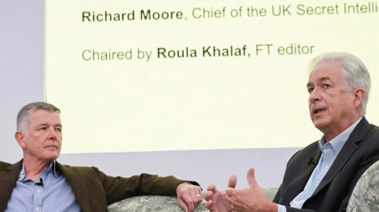 MI6 chief Richard Moore, left, and CIA director William Burns, in London on September 7. 
