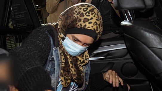 Islamic State-linked woman Kirsty Rosse-Emile gets into a car after arriving at Melbourne Airport this evening.