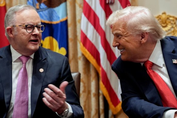 Mates: Trump smiles at Albanese.