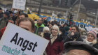 A participant holds a banner with the inscription “Fear makes you sick” at a rally at the weekend. There are fears the latest measures could provoke a more violent response.