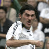 Mikheil Kavelashvili, right, makes a shot on the goal during the Reunification Cup against Chinese national team in Hong Kong, on July 1, 2007