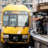 Commuters attempt to board trains at Parramatta Station during train delays across the network yesterday.