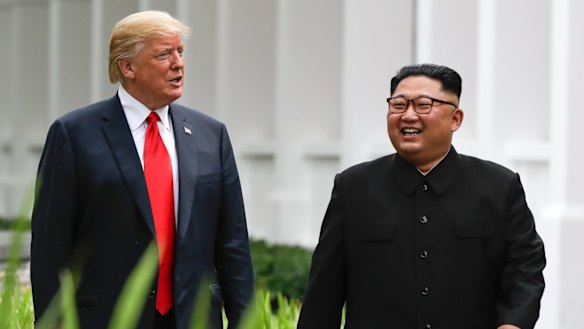 U.S. President Donald Trump and North Korea leader Kim Jong Un walk from their lunch at the Capella resort on Sentosa Island Tuesday, June 12, 2018 in Singapore. (AP Photo/Evan Vucci)