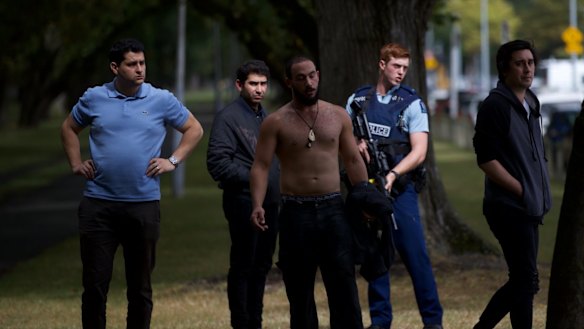 People outside Deans Ave mosque on edge of Hagley Park.