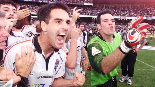 Wollongong players celebrate after their remarkable grand final comeback win against the Glory in 2000. 