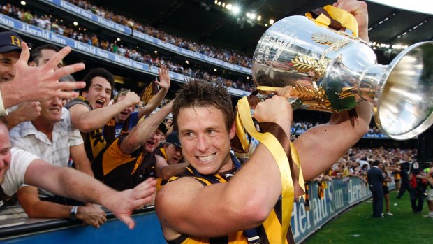Dew celebrates Hawthorn's 2008 grand final win against the Cats. 