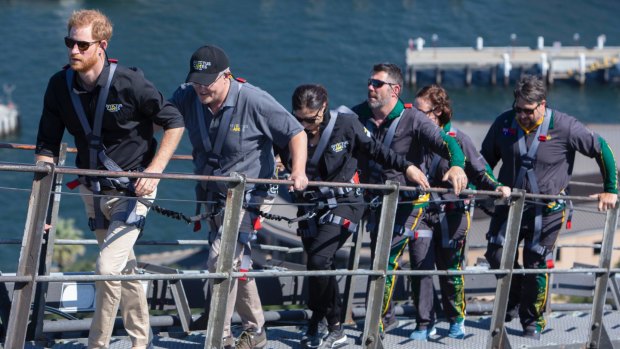 Britain's Prince Harry, Prime Minister Scott Morrison and Invictus Games representatives climb the Sydney Harbour Bridge on Friday.