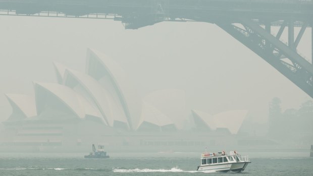 The thick smoke obscures Sydney's Opera House and Harbour Bridge.