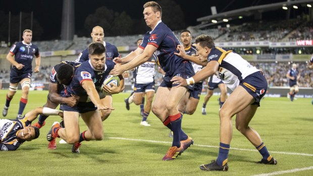 The Rebels' Jack Maddocks heads for the corner post against the Brumbies on Friday night. 