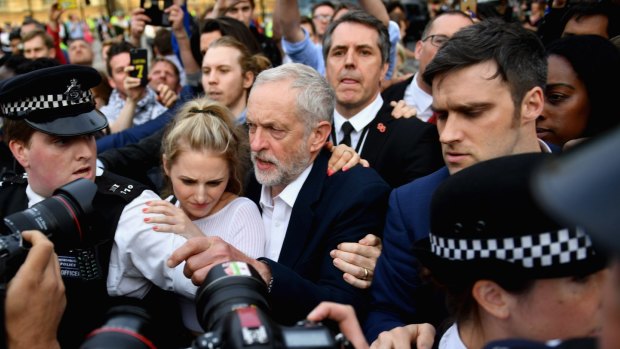 Corbyn arrives to deliver a speech during Momentum's 'Keep Corbyn' rally in 2016.