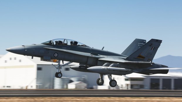 A Royal Australian Air Force F/A-18A Hornet takes off at RAAF Base Townsville.