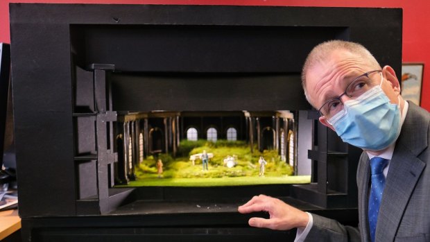 Federal Arts Minister Paul Fletcher looks over a model set at MTC.