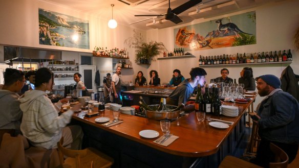 At La Pinta, diners gather around the U-shaped bar.